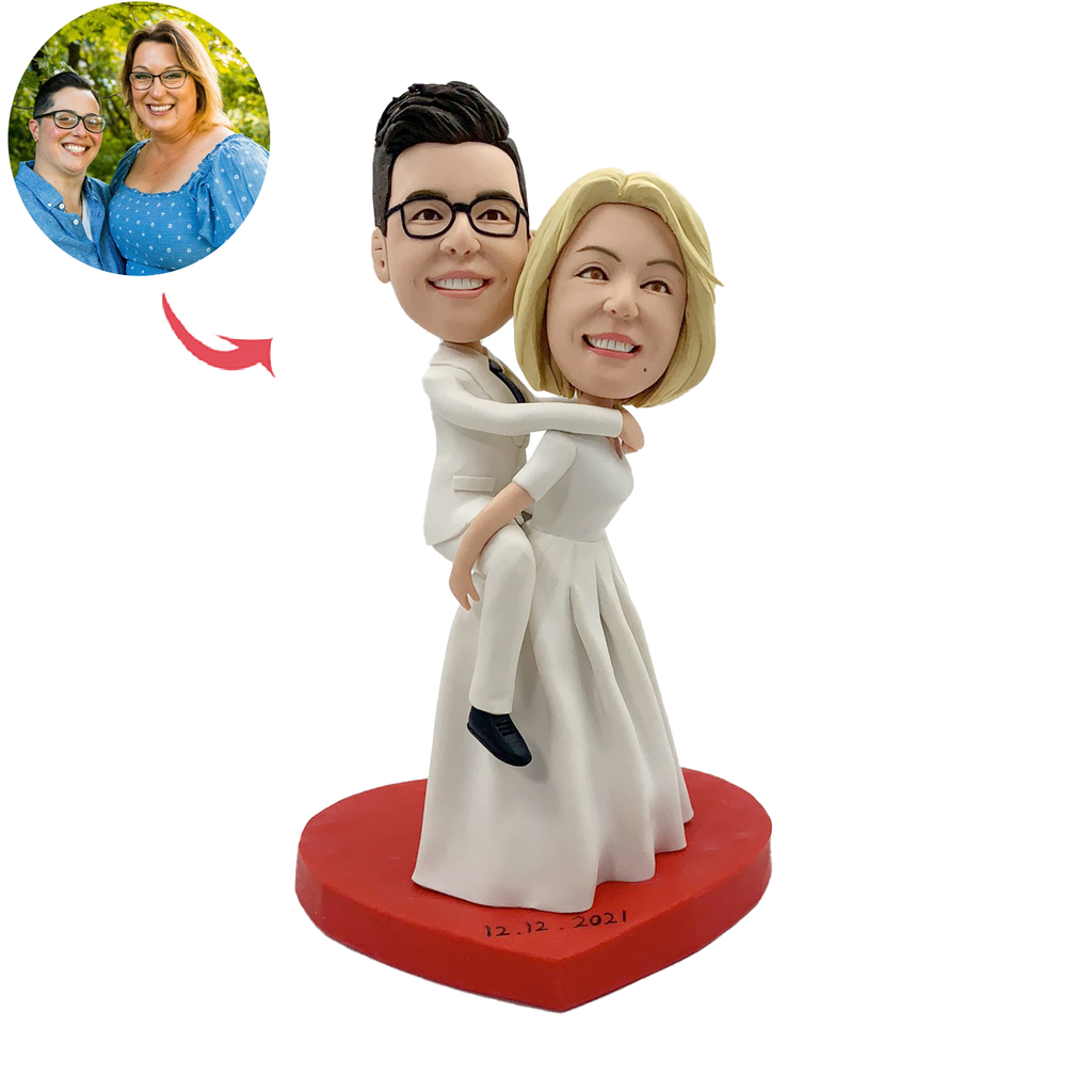 Bobblehead da matrimonio, sposa che trasporta lo sposo
