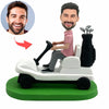 Idea regalo per la festa del papà: Bobblehead che guida un golf cart