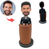 Bambola Bobblehead personalizzata che tiene un discorso