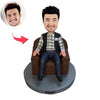 Bobblehead personalizzati raffiguranti un uomo seduto sul divano