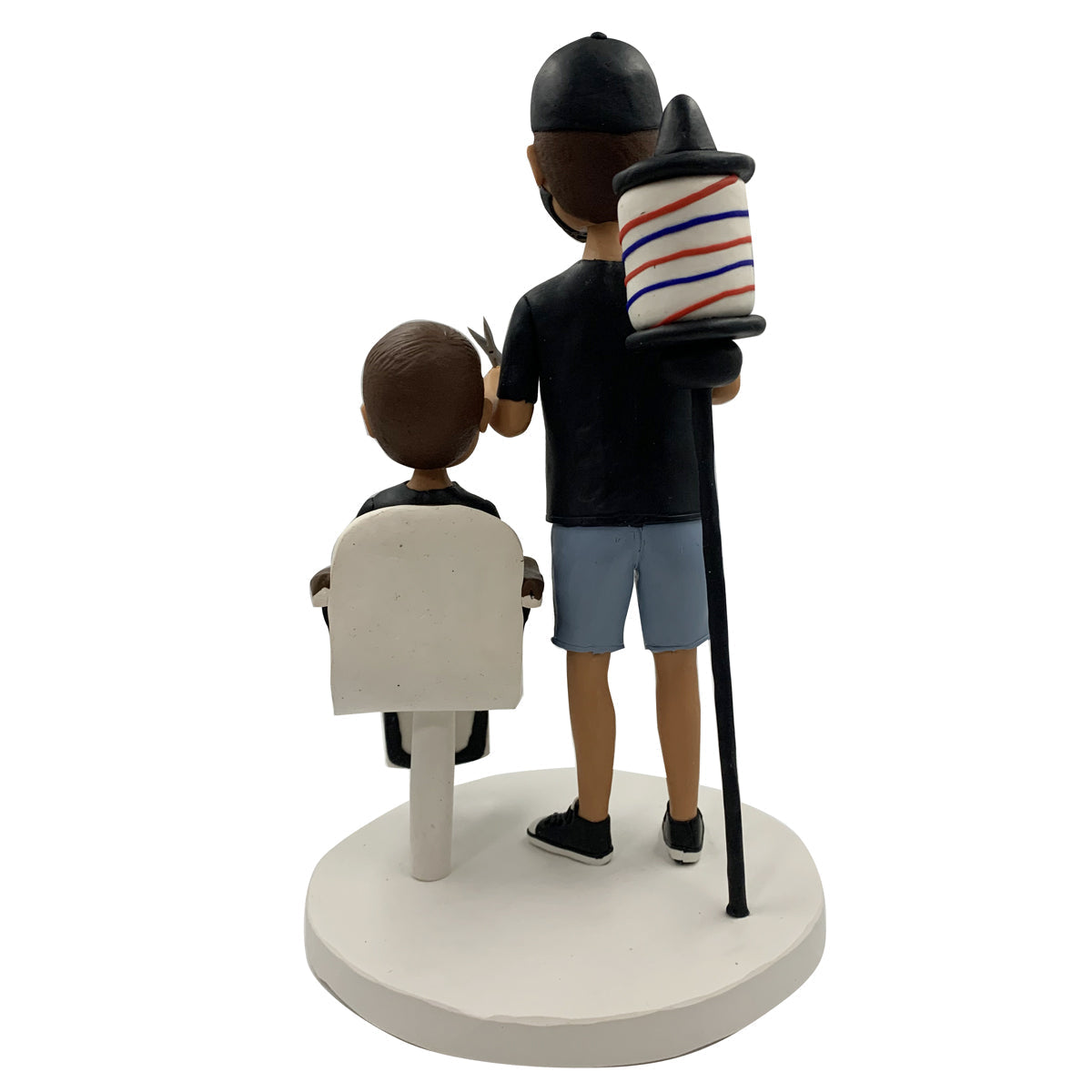 Bobblehead barbiere con bambino