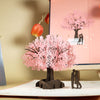 Biglietto d'auguri pop-up 3D con coppia romantica sotto un ciliegio