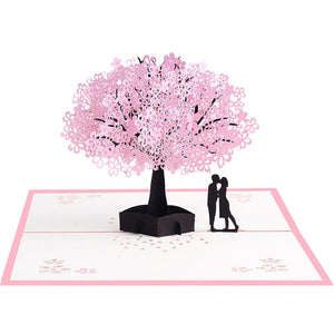 Biglietto d'auguri pop-up 3D con coppia romantica sotto un ciliegio