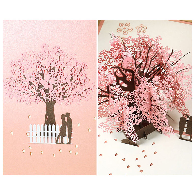 Biglietto d'auguri pop-up 3D con coppia romantica sotto un ciliegio