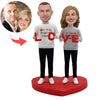 Bobblehead di coppia personalizzato con la scritta "AMORE"