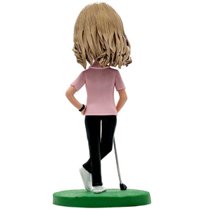 Bobblehead di golfista felice con maglietta rosa