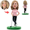 Bobblehead di golfista felice con maglietta rosa