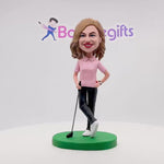 Bobblehead di golfista felice con maglietta rosa