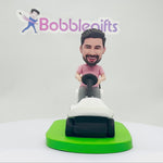 Idea regalo per la festa del papà: Bobblehead che guida un golf cart